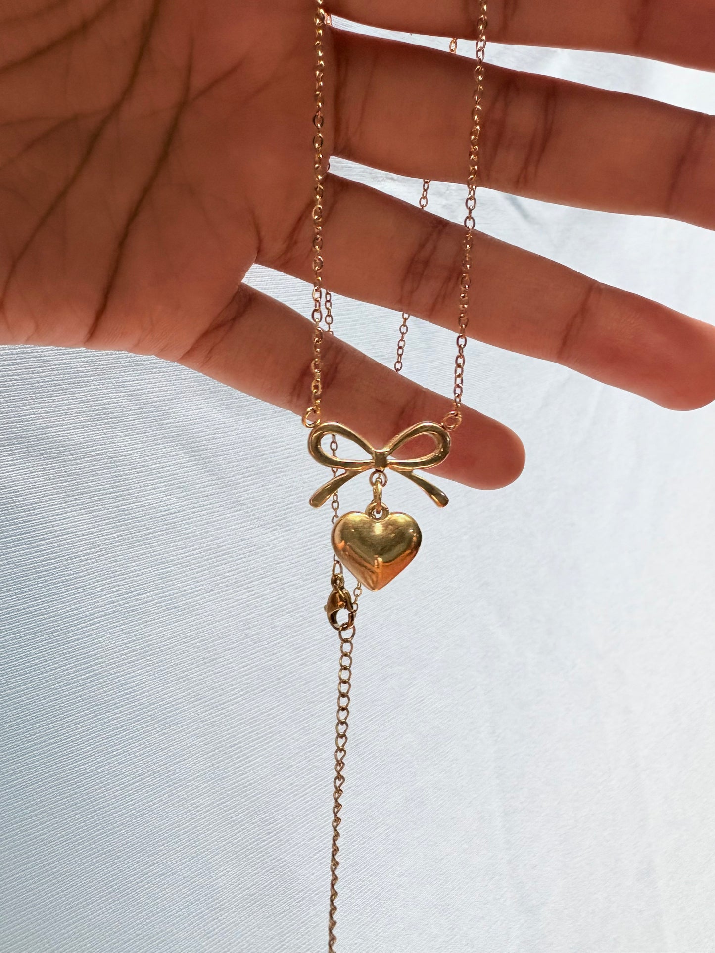 Bow heart pendant