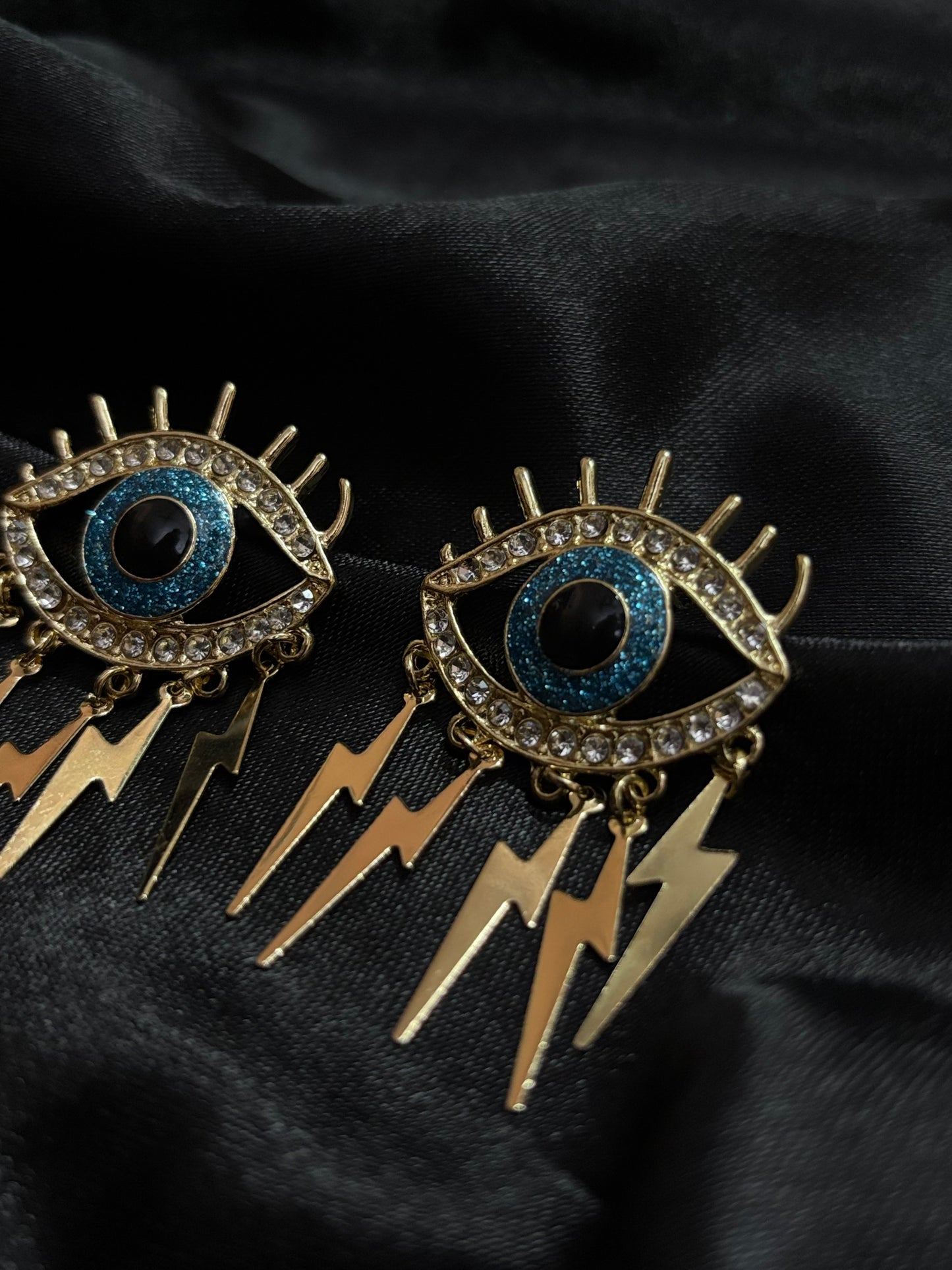 evil eye with current designed earring
