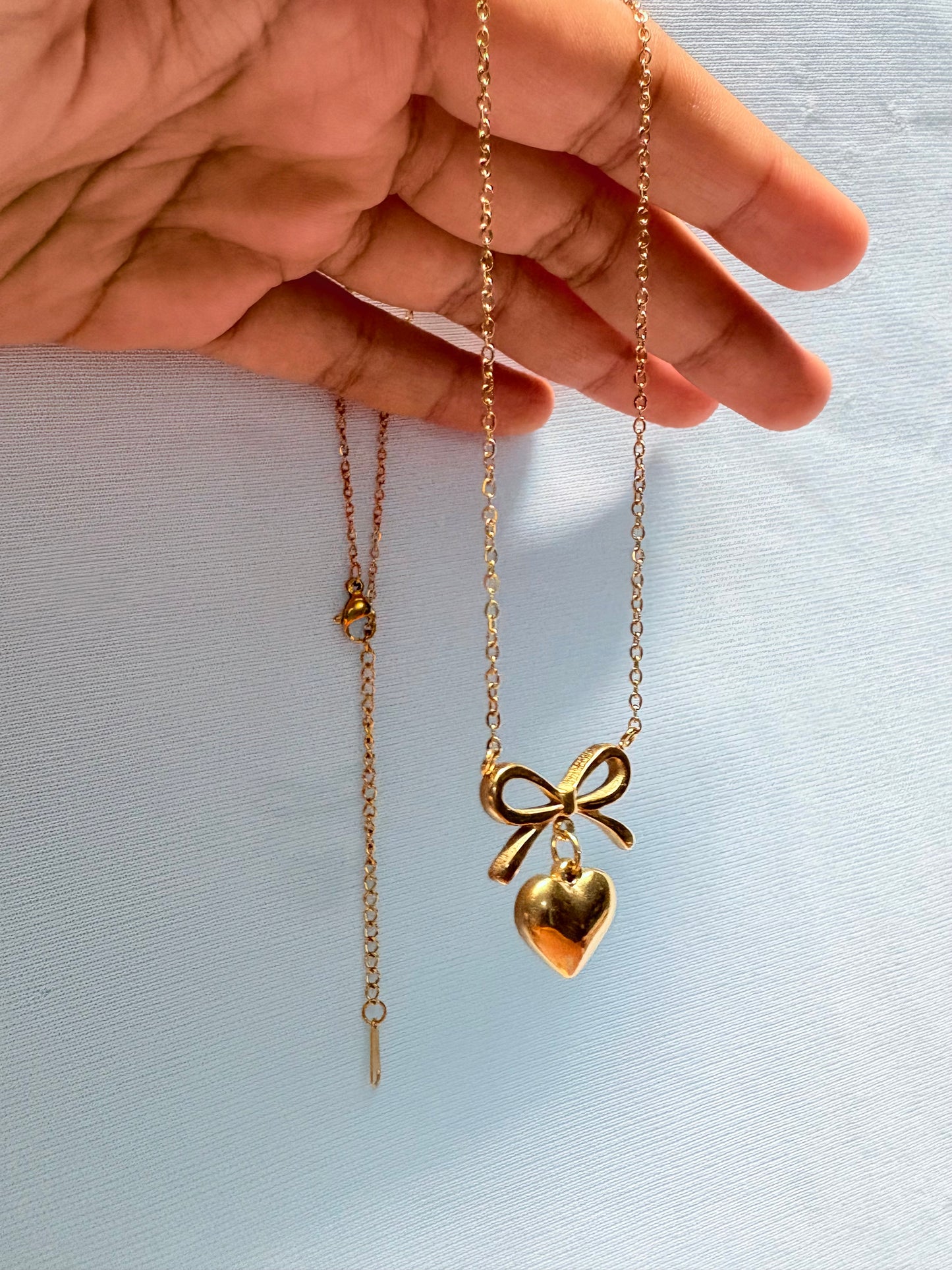 Bow heart pendant