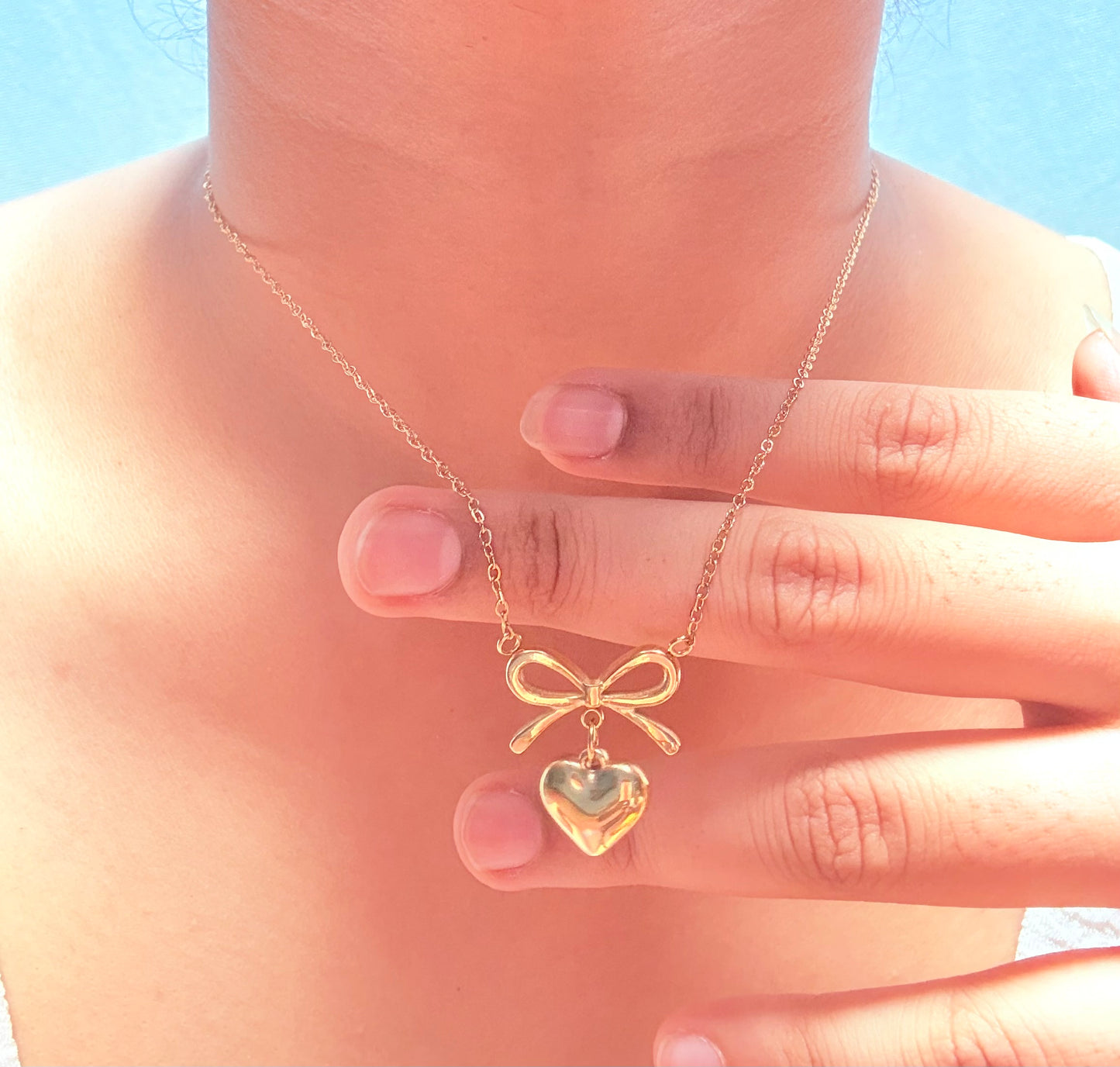 Bow heart pendant