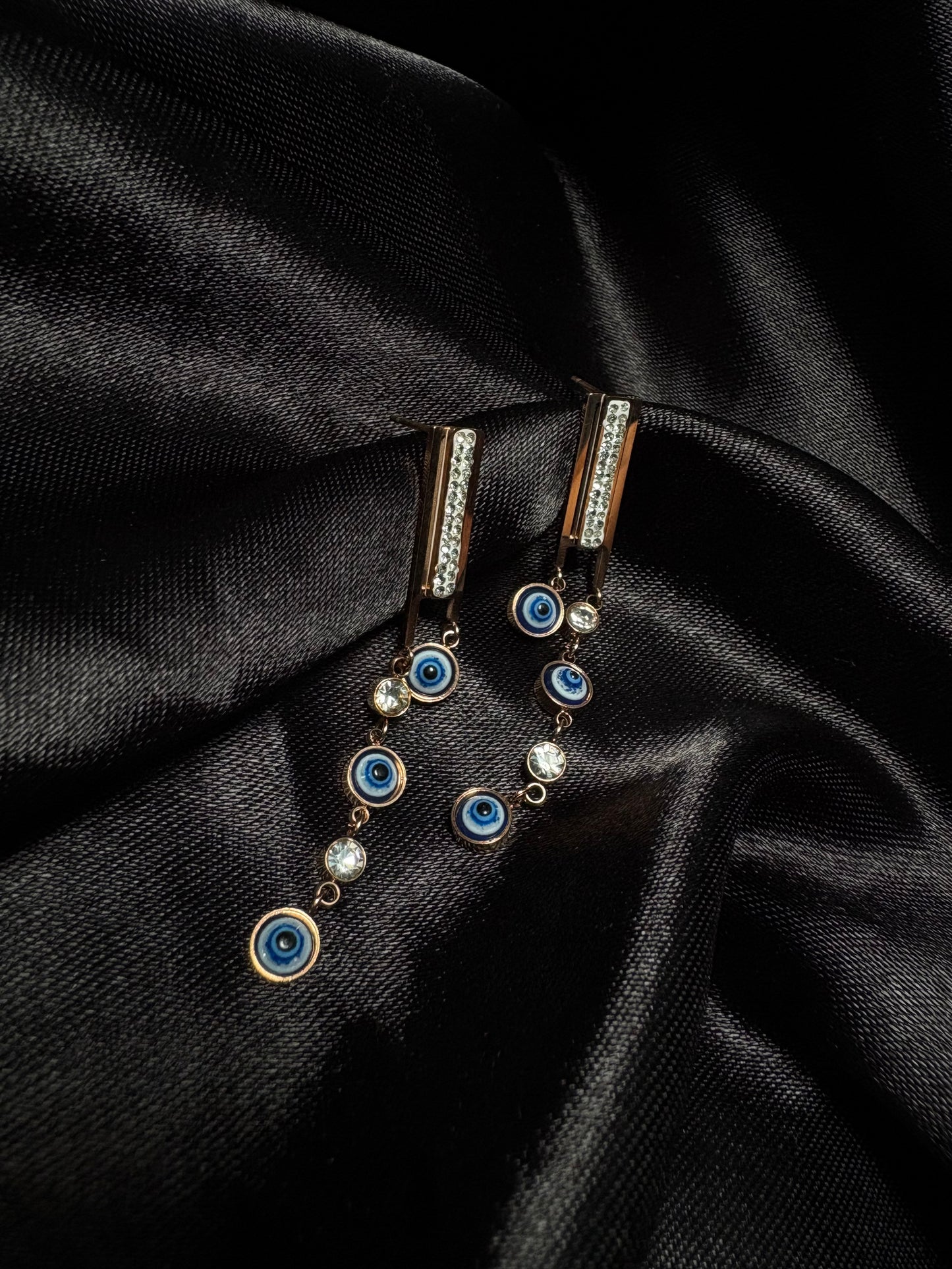 Tiny evil eye dangle