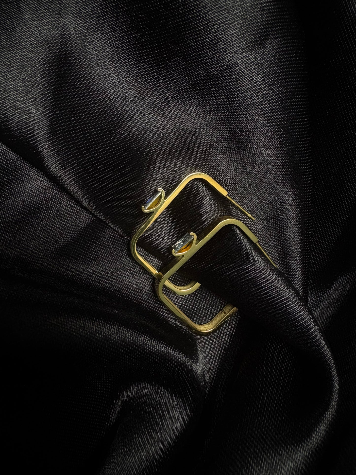 Square shaped edgy studs