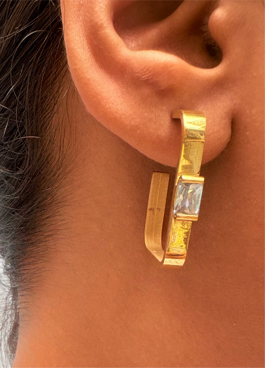 Square shaped edgy studs